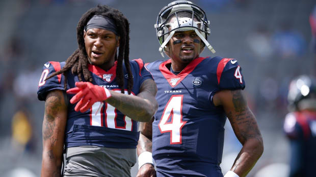 Houston Texans quarterback Deshaun Watson (4) speaks with wide receiver DeAndre Hopkins (10) prior to the game against the Los Angeles Chargers at Dignity Health Sports Park.